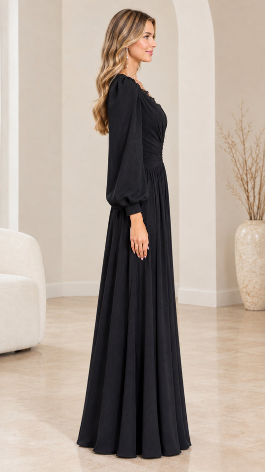 Side profile view of elegant black long sleeve maxi gown on model