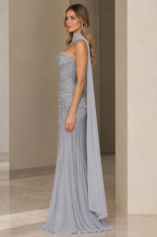 Side view of woman wearing Silver Grey embellished floor-length formal gown with scarf