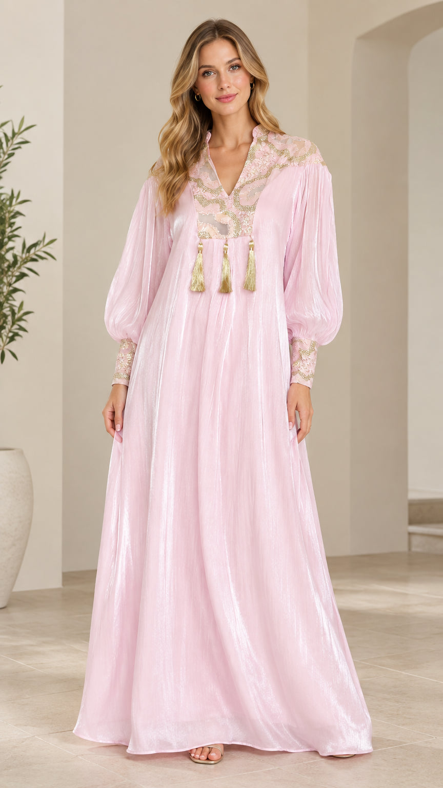 Full-length front view of model wearing Blush Pink embroidered shimmer maxi dress with tassels
