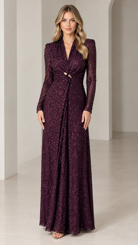 Front view of woman wearing burgundy long-sleeve sequin evening maxi gown