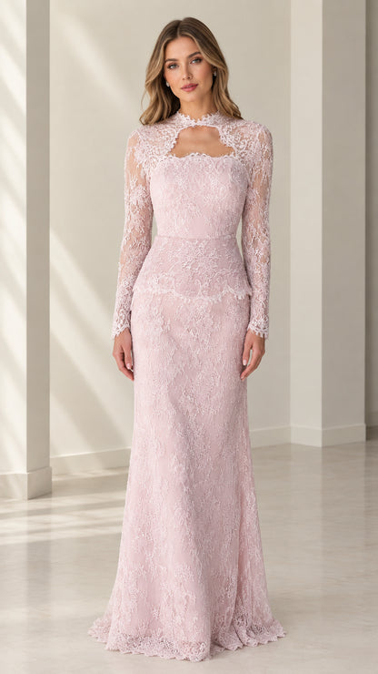 Front full view of woman wearing blush pink long sleeve lace evening gown with cutout neckline