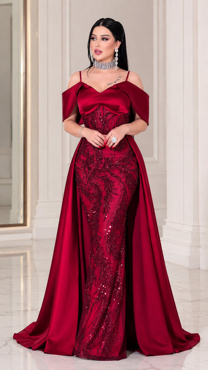 Front full-length view of model wearing Wine Red off-the-shoulder beaded mermaid gown with overskirt
