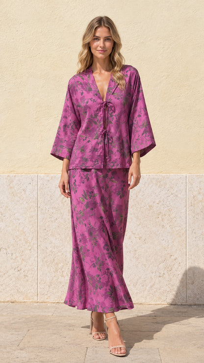 Full front view of model wearing magenta floral print tie-front top and maxi skirt set