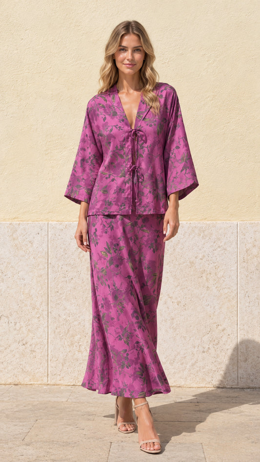 Full front view of model wearing magenta floral print tie-front top and maxi skirt set