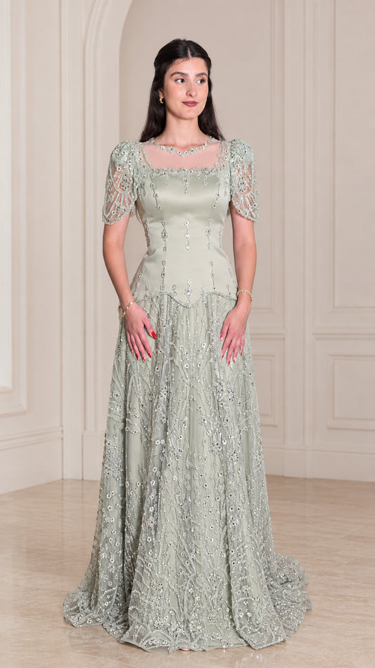 Front view of model wearing Sage Green beaded short sleeve evening gown