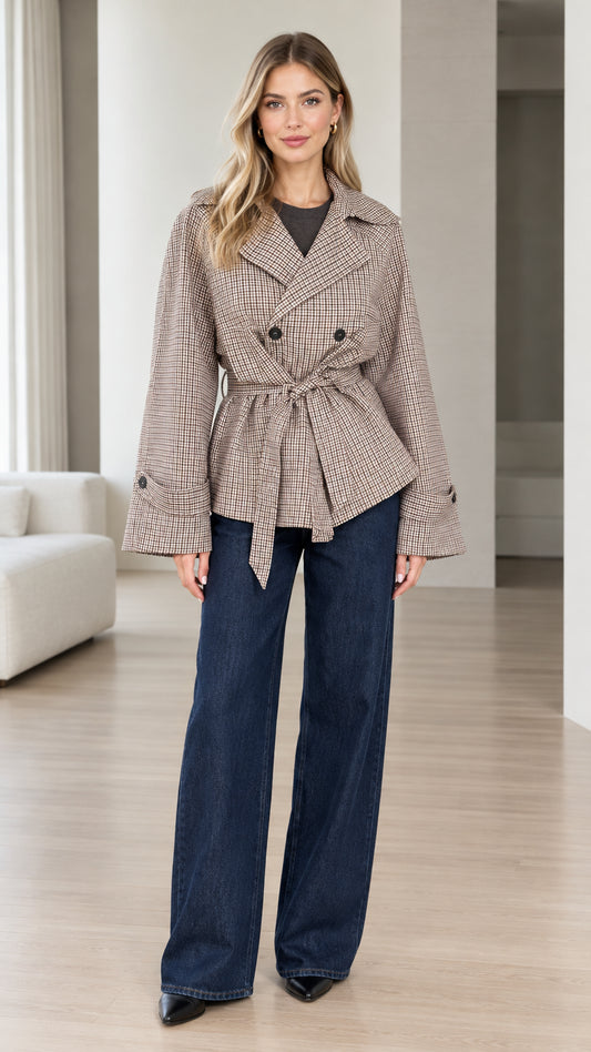 Front full-length view of model wearing brown plaid belted short jacket with wide-leg jeans