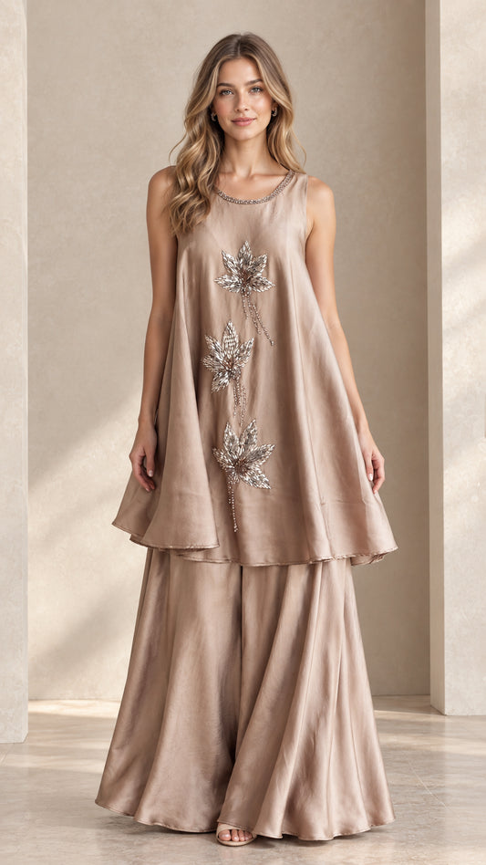 Front view of champagne sleeveless beaded tunic and palazzo pant set