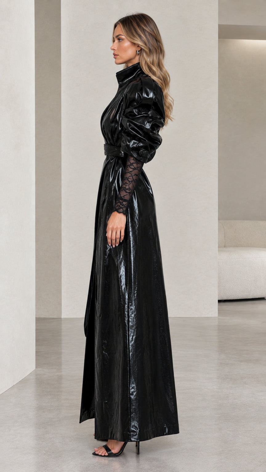 Side profile view of black glossy patent faux leather maxi coat