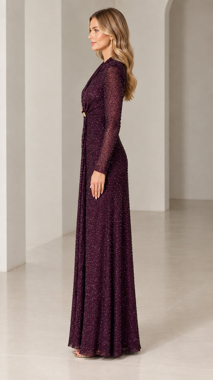 Side profile of burgundy sequin floor-length formal gown with long sleeves