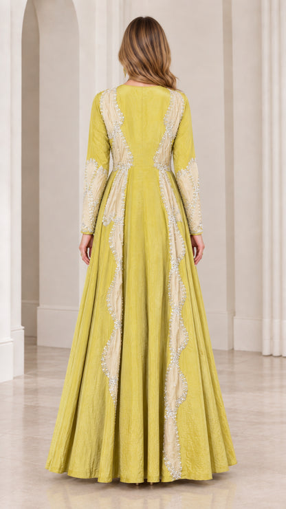 Back view of chartreuse green A-line evening dress with structured panels