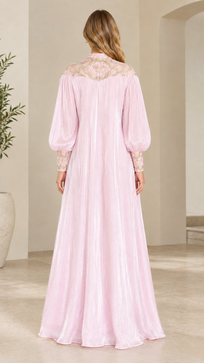 Back view of model in Blush Pink shimmer maxi dress showing back embroidery detail