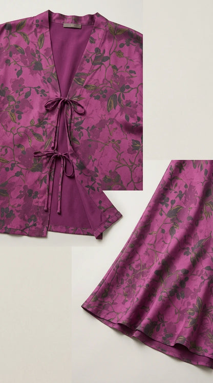 Close-up detail of the tie-front closure and hem of the magenta floral fabric