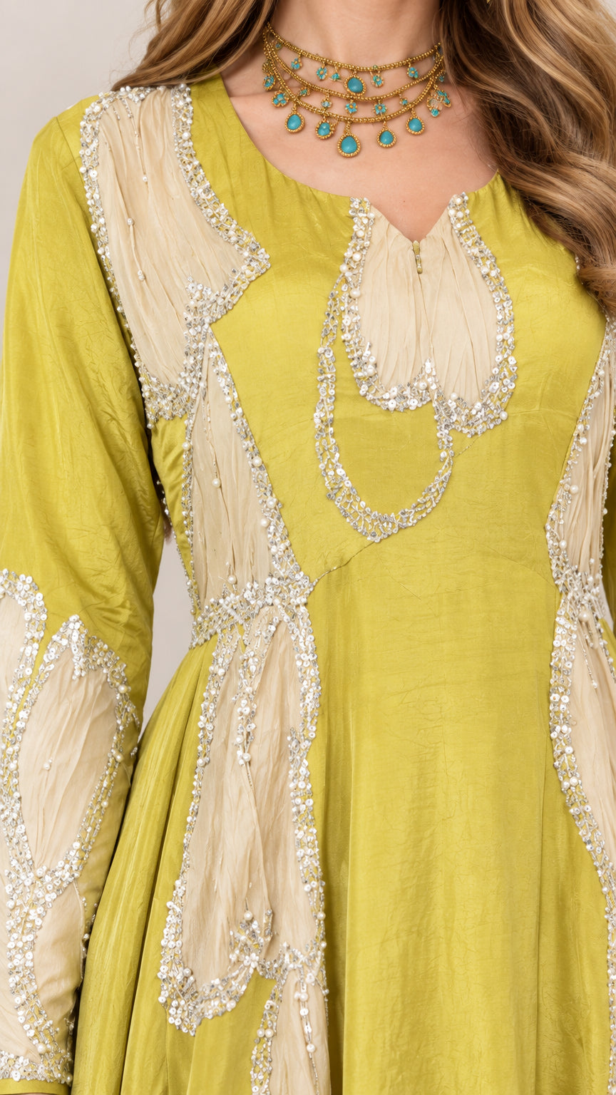 Close-up detail of neckline and bodice embroidery on chartreuse maxi gown