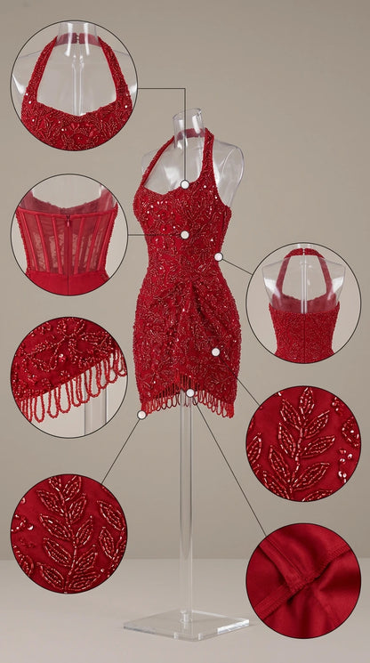 Close-up details of red dress neckline, corset boning, beading, and fringe hem