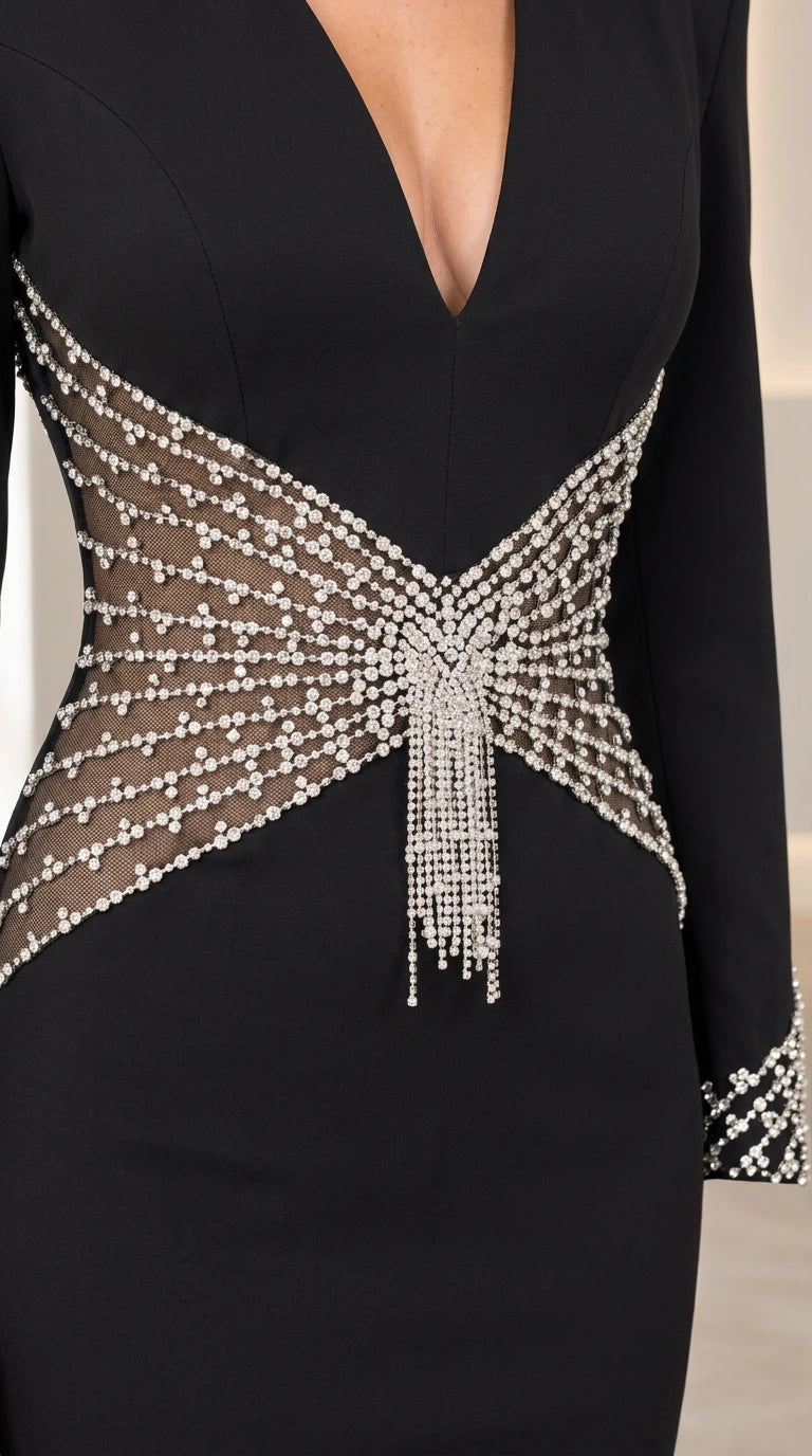 Close-up detail of sheer mesh waist panel with sparkling rhinestones and center fringe tassel