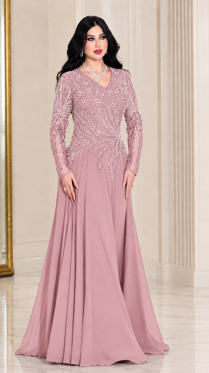 Front view of woman wearing dusty pink long sleeve beaded formal maxi dress