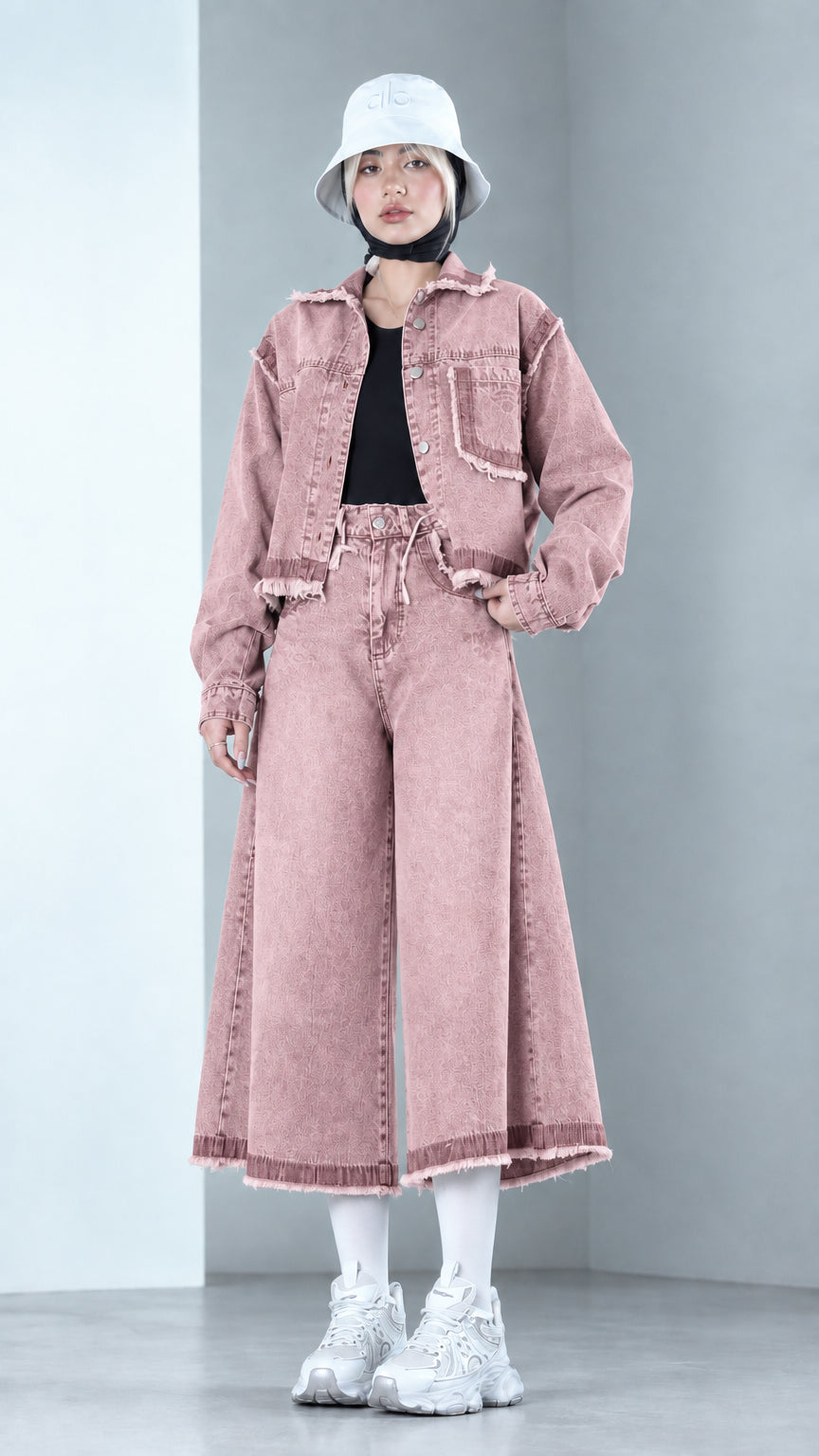 Front view of model wearing Dusty Pink raw hem denim jacket and wide-leg pants set